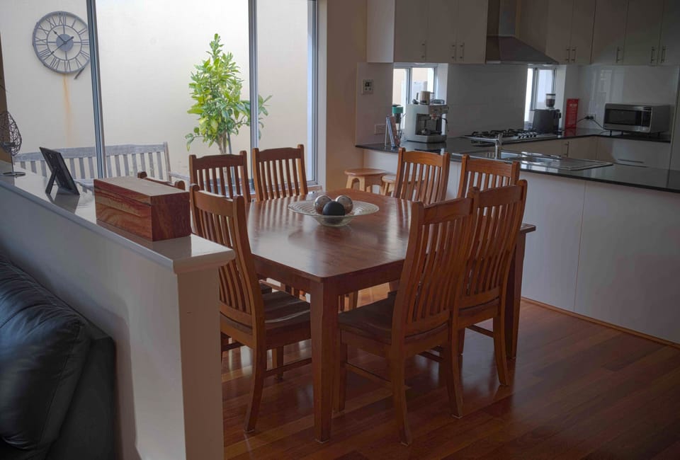 Downstairs Dining Area with Kitchen in the Background