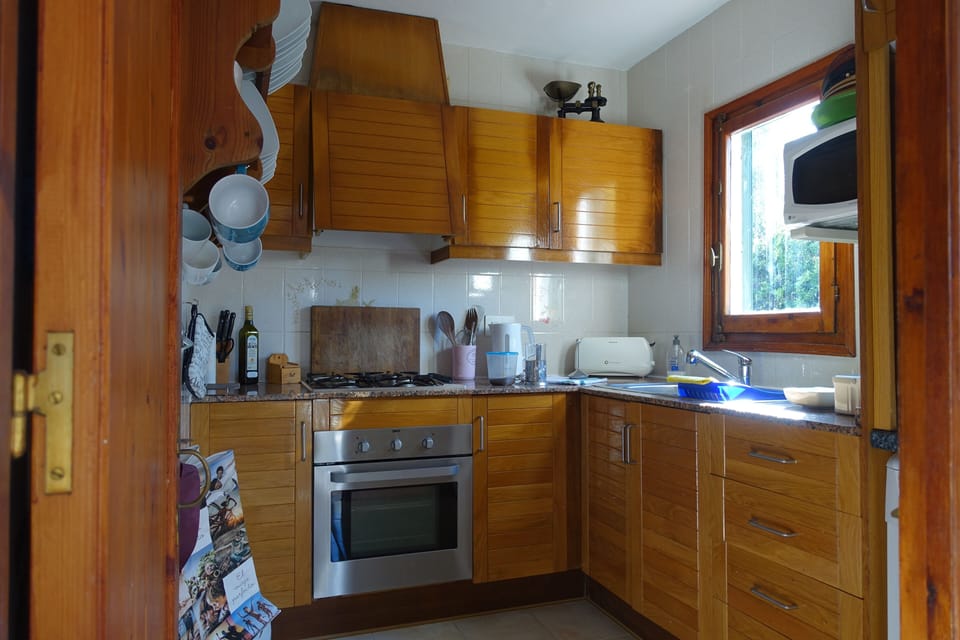 kitchen with gas stove and electric oven, dishwasher, fridge, microwave. 