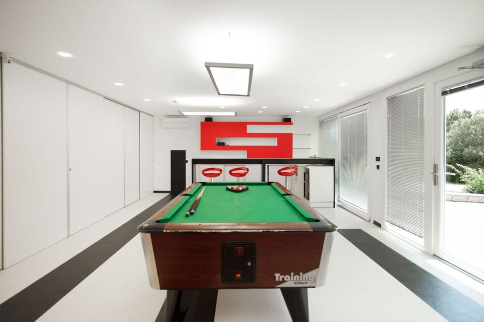 Game room with sound system, pool table, darts, football table and flat screen