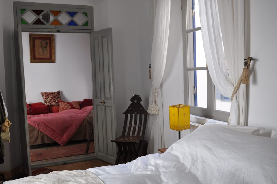 The bedroom with 160 cm bed and a small salon with single bed. Private shower