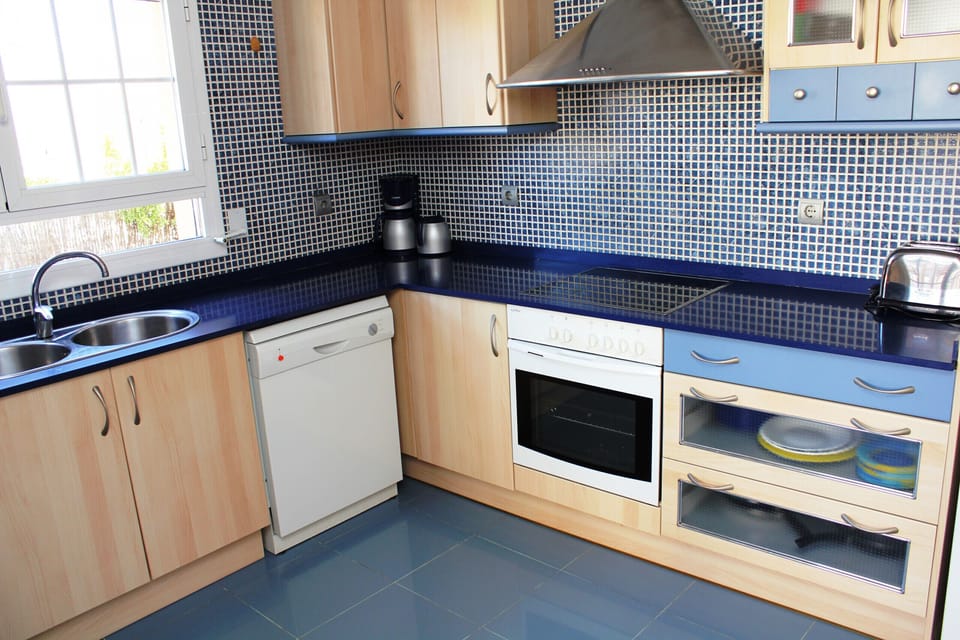 The separate, modern, and fully equipped kitchen in House Agostino offers plenty of space and comfort for self-catering.