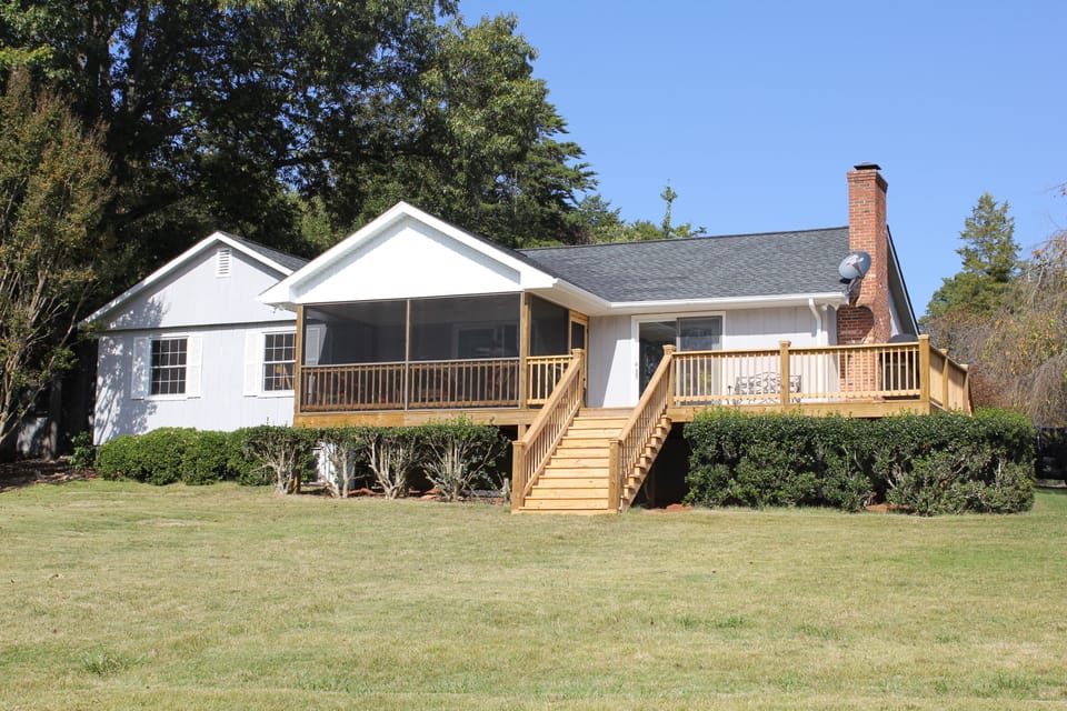 Large front yard; plenty of room to play and gentle walk from dock to house.