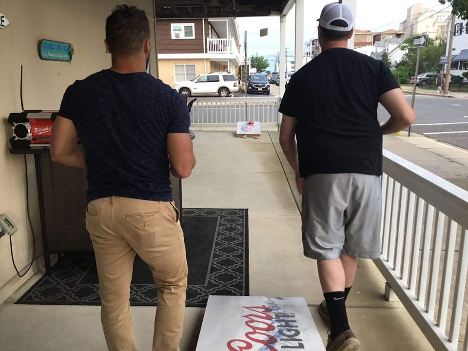 Covered porch large enough to play cornhole!!!!