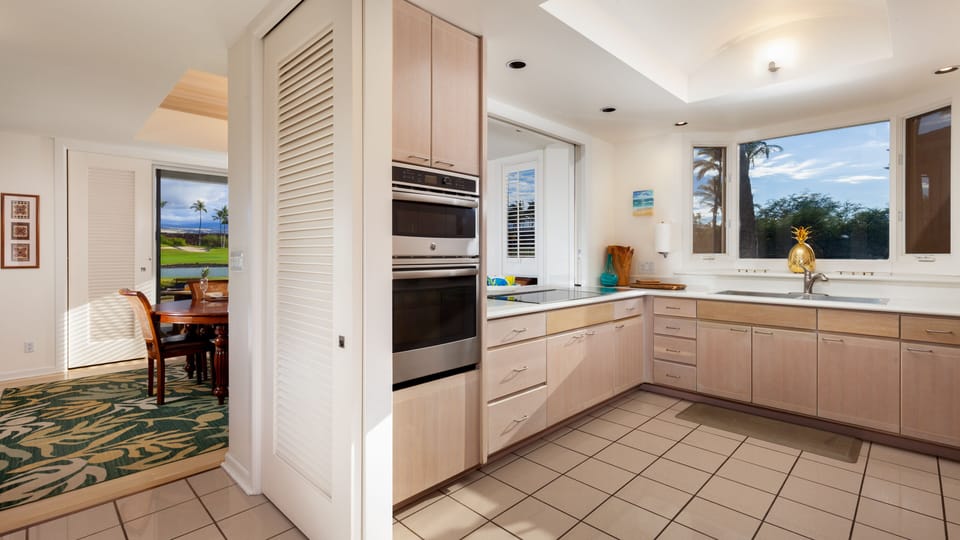 Fully stocked kitchen with essential cookware, spices and oils