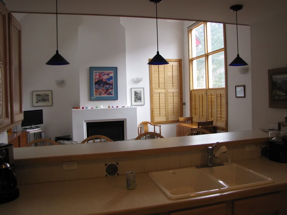 Kitchen with view into living room.