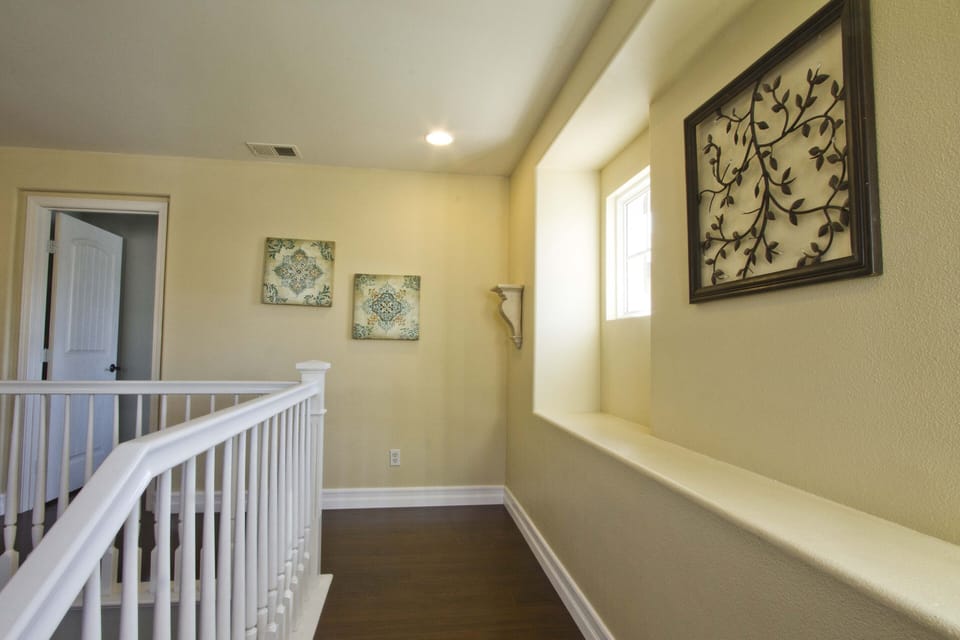 Upstairs Landing with  nice and clean solid surface flooring throughout