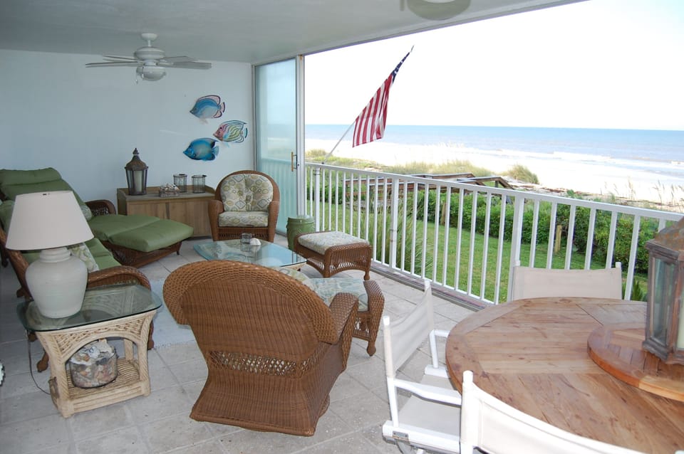 Relaxing on your lanai with private beach access.
