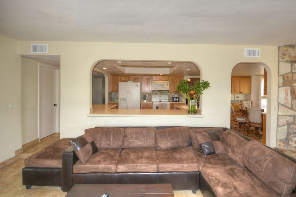A very spacey family room to relax and watch the lake through a big glass window
