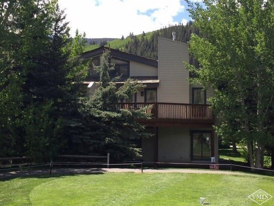Back of house shaded by trees
