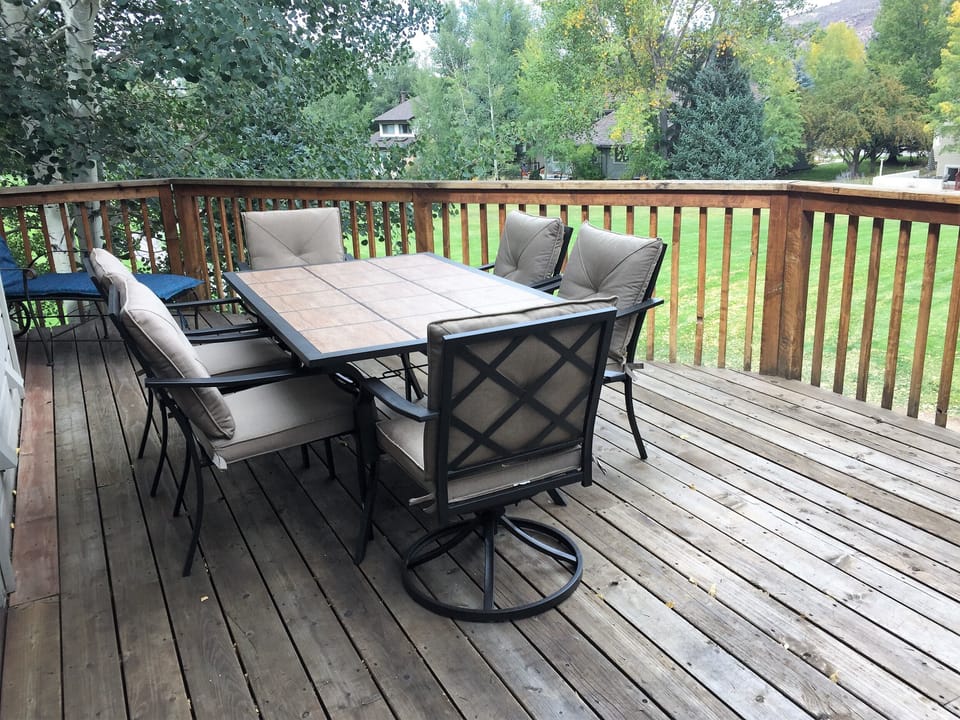 Deck shaded by trees and visited by hummingbirds