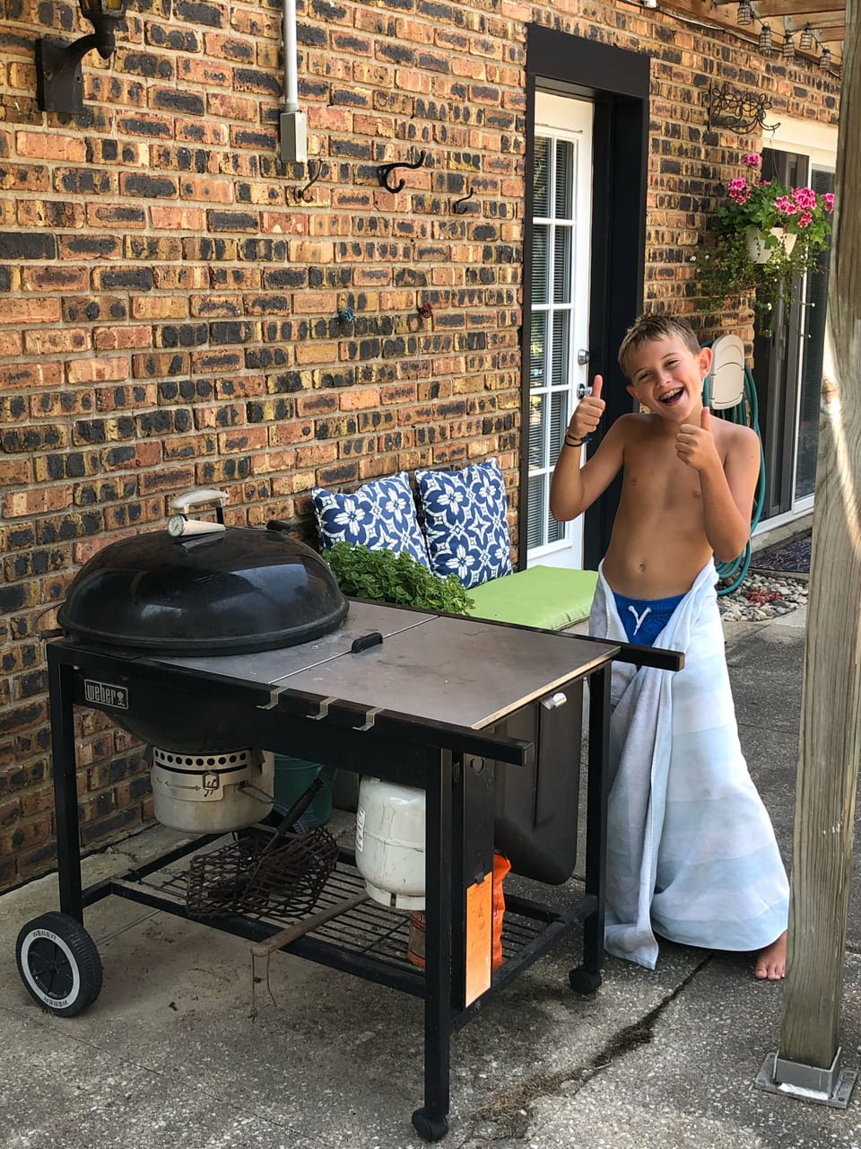 Propane start/charcoal grill-outdoors back yard