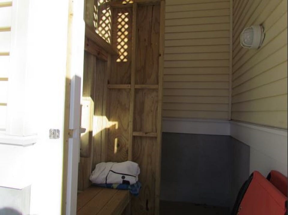 outside shower with changing area.