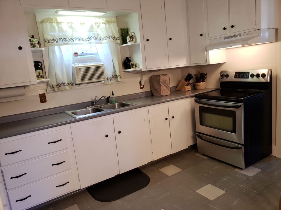 Kitchen with electric stove and oven perfect for an Adirondack breakfast!