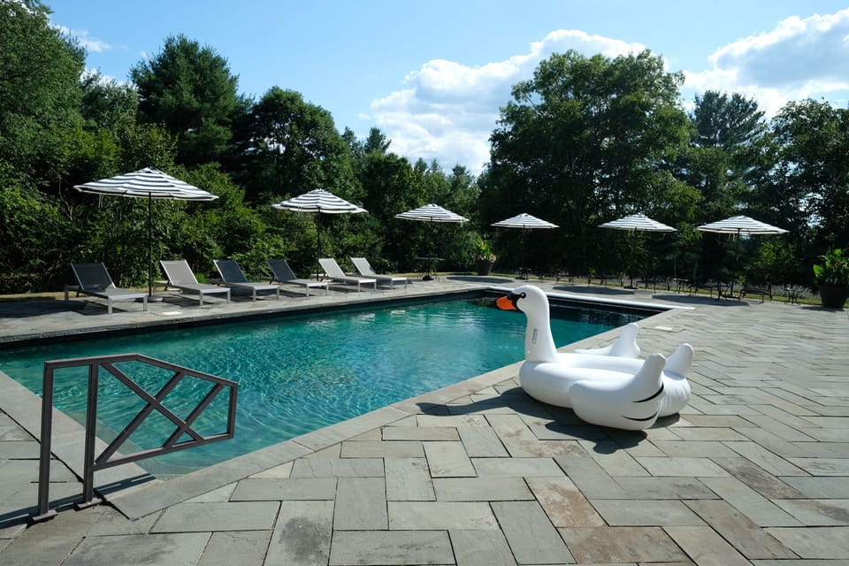 Gunite pool with 12 lounge chairs. (Volleyball for non loungers.)