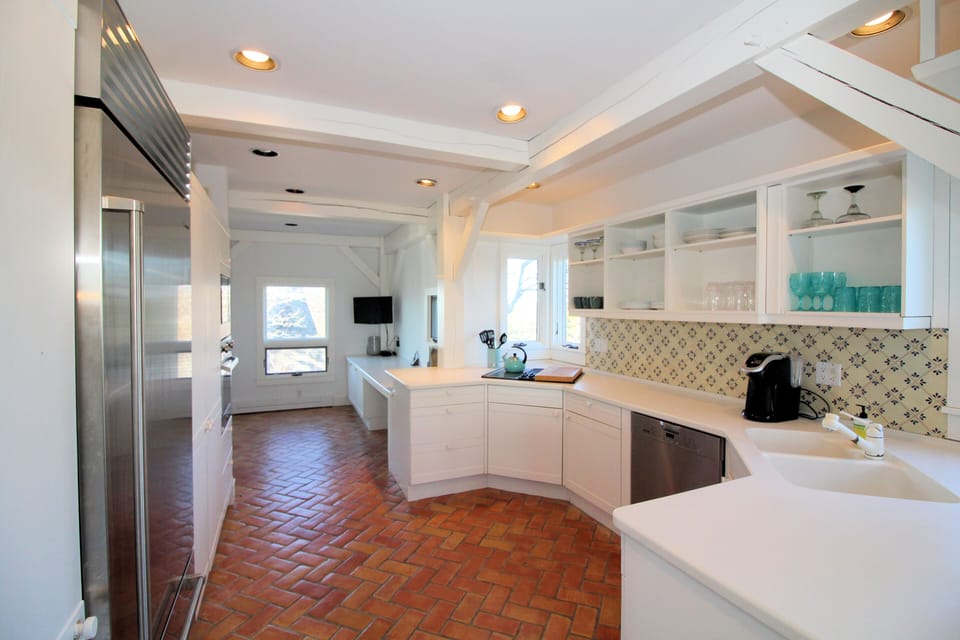 Nicely appointed kitchen with sub zero refrigerator