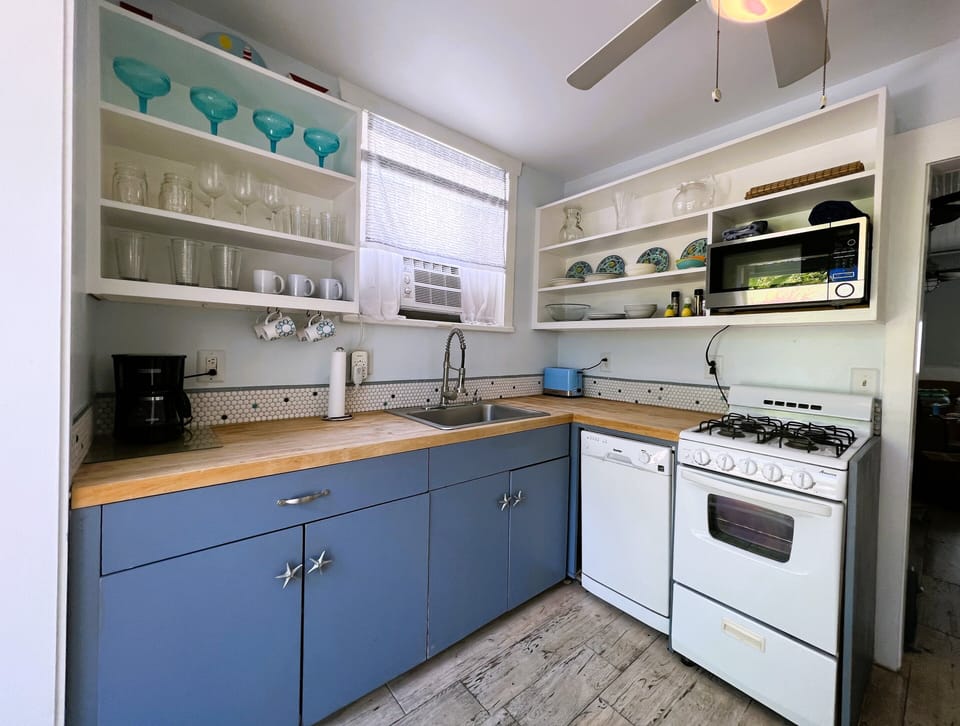Fully equipped beachy cottage style kitchen.