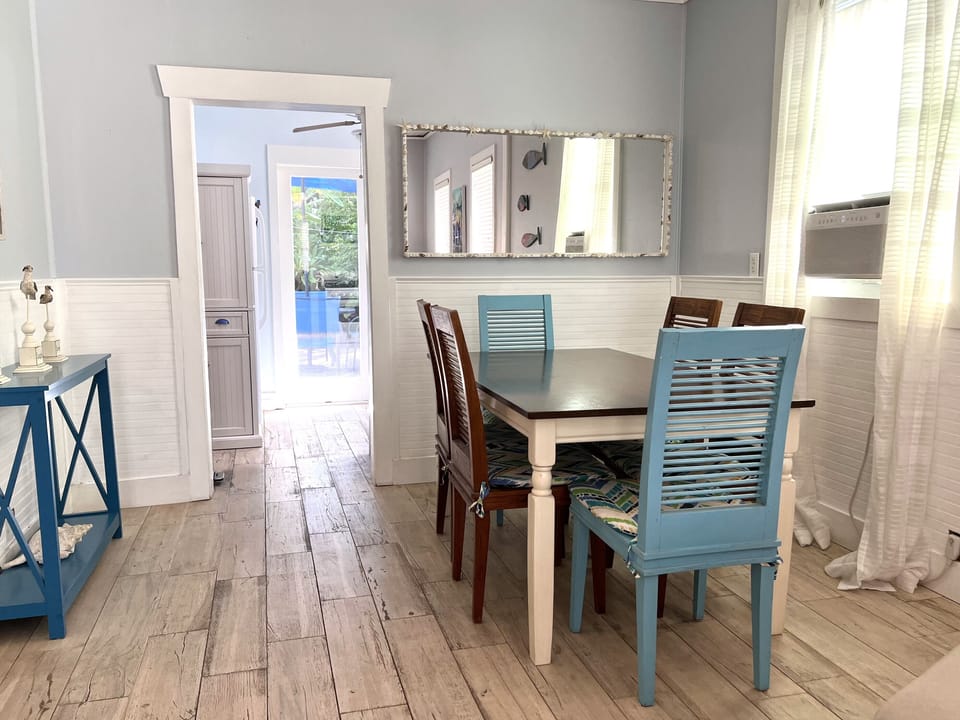 Dining area looking toward kitchen and back yard.