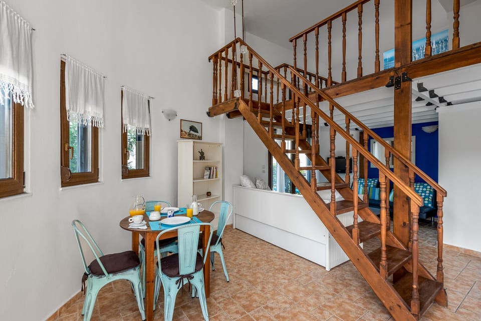 Dining area and the staircase leading to the mezzanine floor