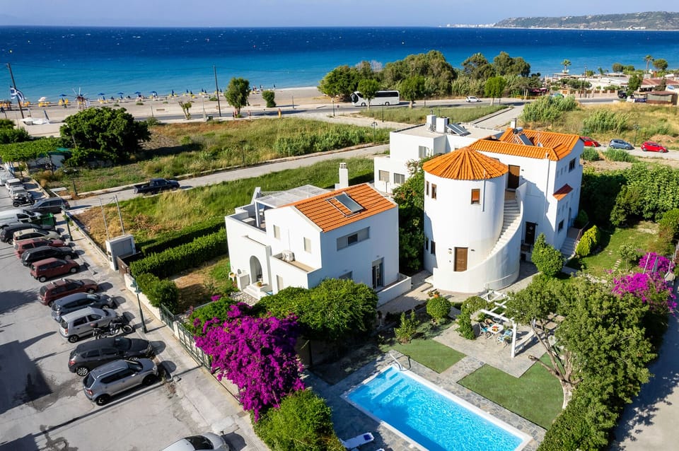 Aerial view of Villa Mylos pool, garden and local beach