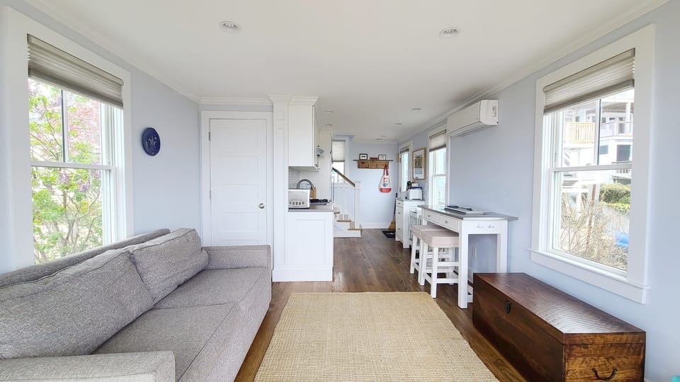 Living room with kitchen and dining area beyond