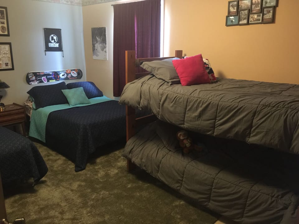 Bunk beds in room with two Full