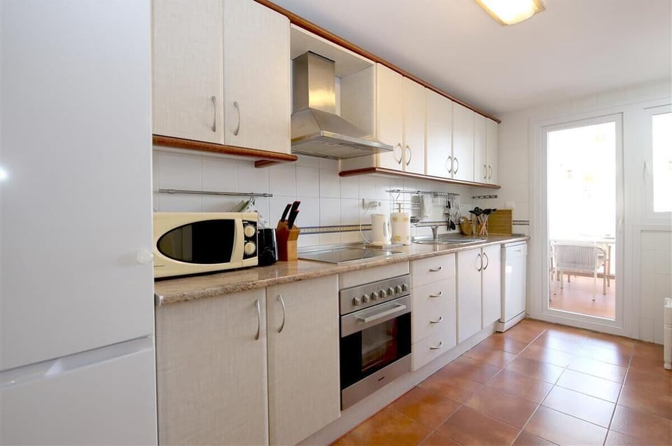 Spacious kitchen is fully fitted with all the appliances 