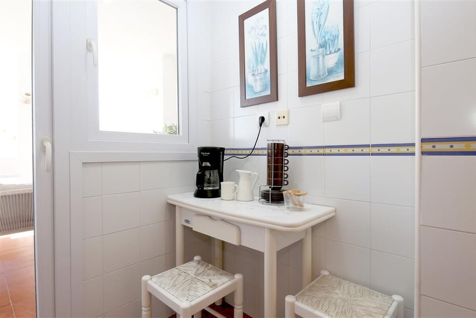 Coffee area for two guests on a side of the kitchen