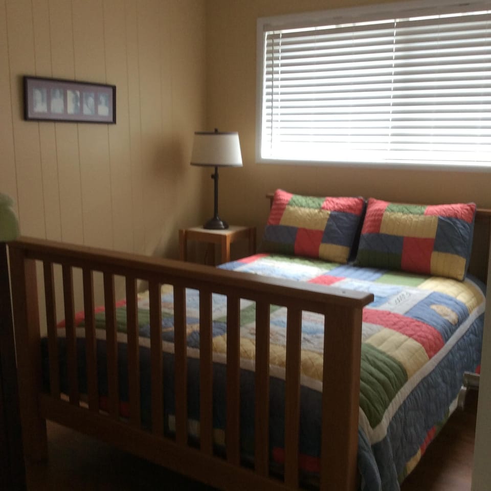 Full size bed in guest bedroom 