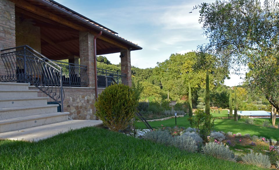 Steps off the veranda to the gardens and infinity edge pool