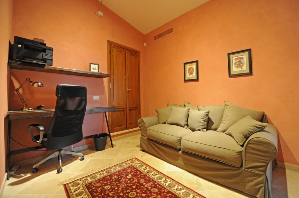 SIENA Bedroom Office with outdoor patio looking up at Montepulciano