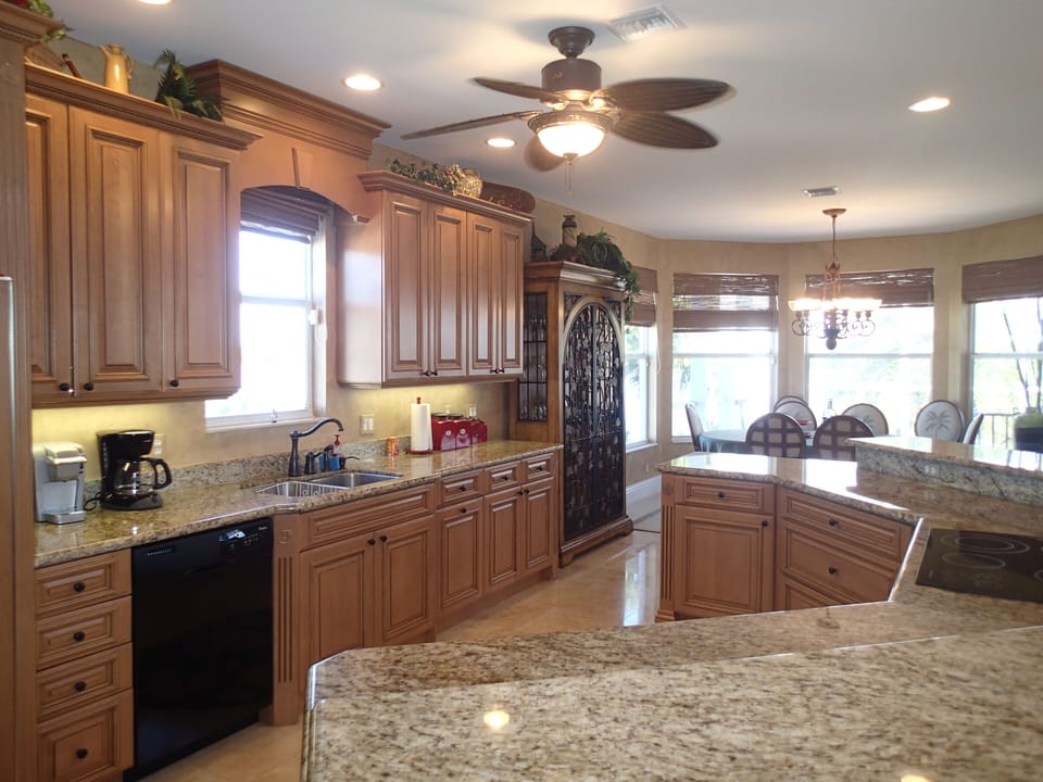 Gourmet kitchen with dining area for eight and breakfast bar for six