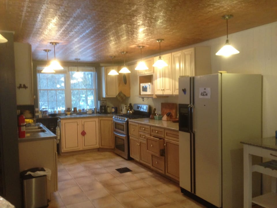 kitchen - well stocked with pots and pans, glasses, mugs, staples