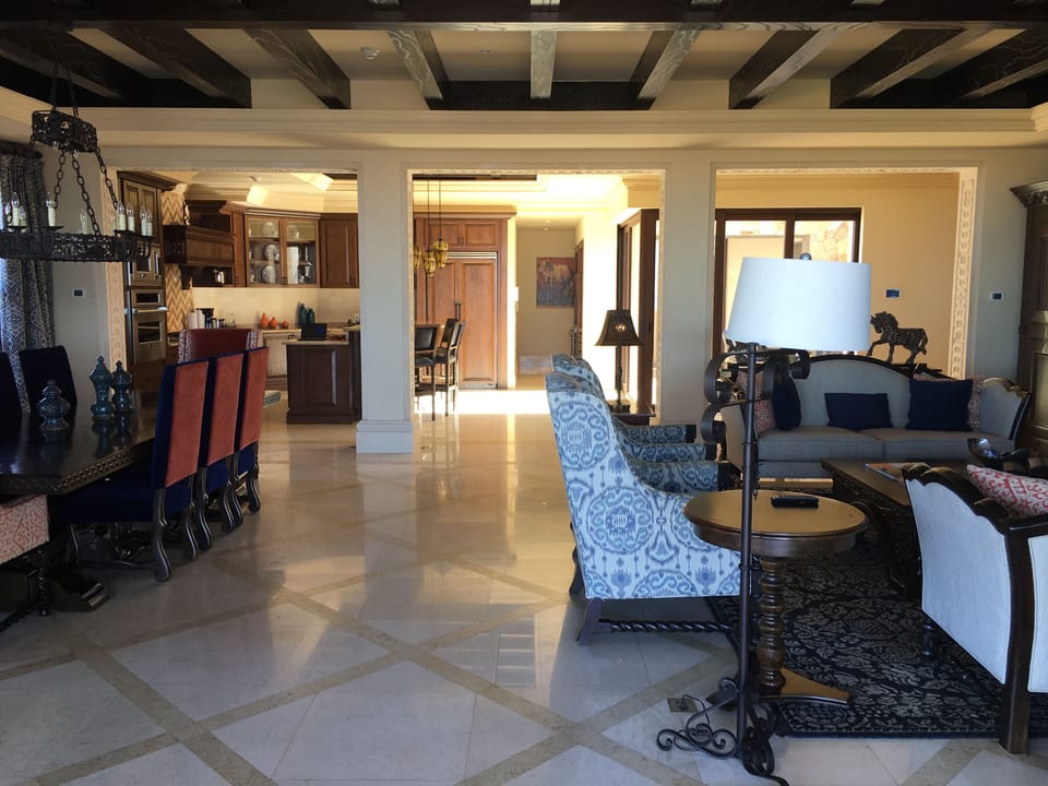 Large living area is open to kitchen, outdoor sportsbar/pool w/ infinity slider