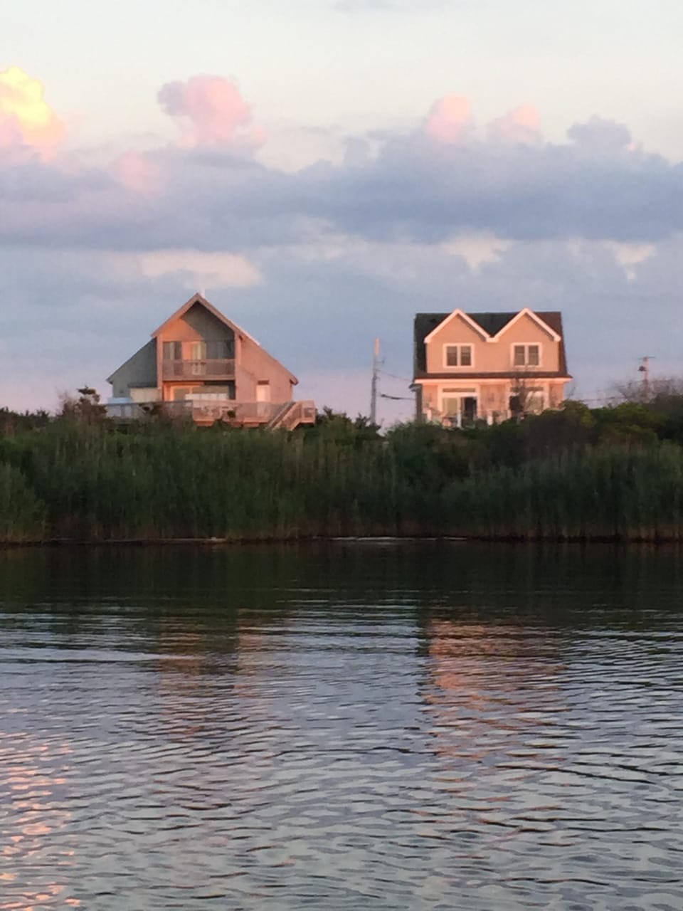 rear view from pond- the house is on the left