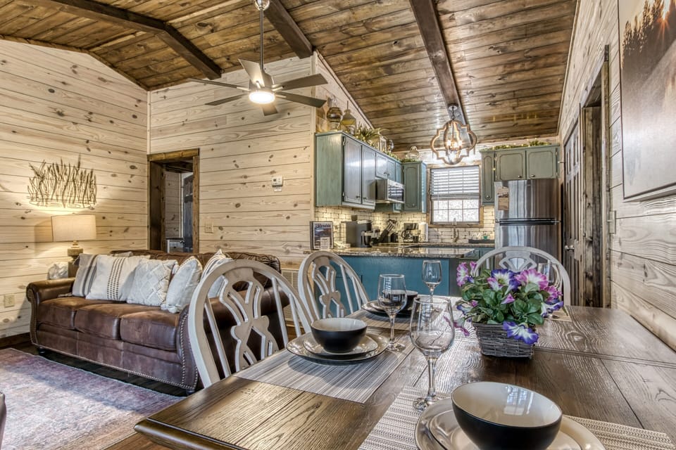 Cabin in Pigeon Forge "Water's View" - Dining table, living room, and kitchen