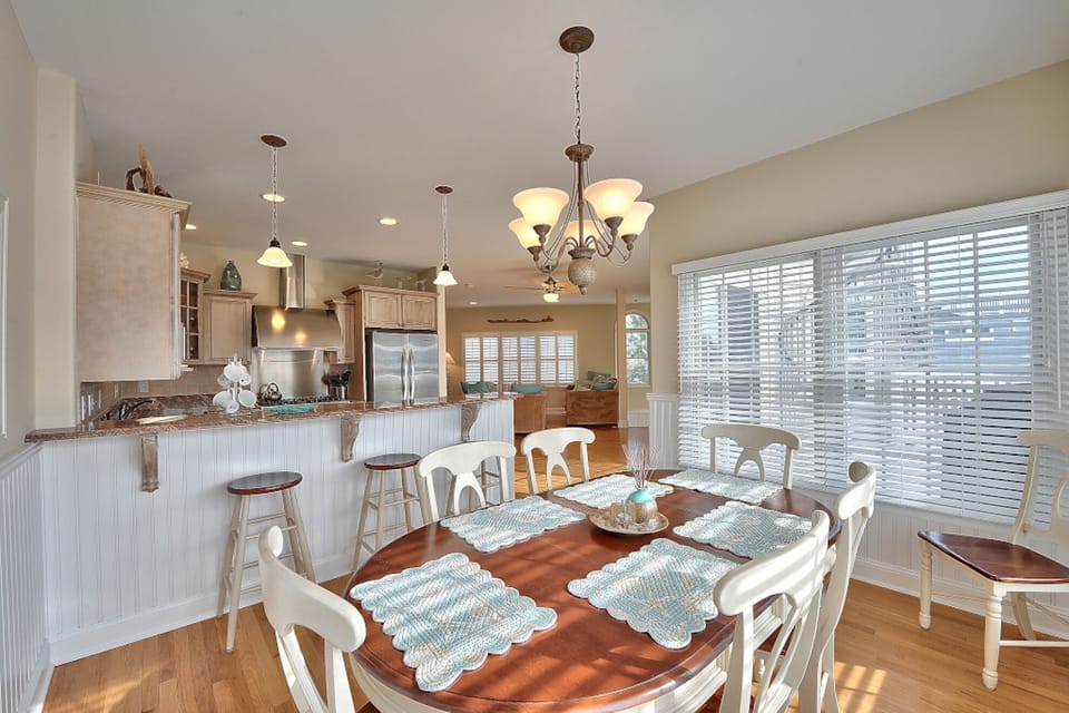 Floor 3: Dining room view facing breakfast bar and living room