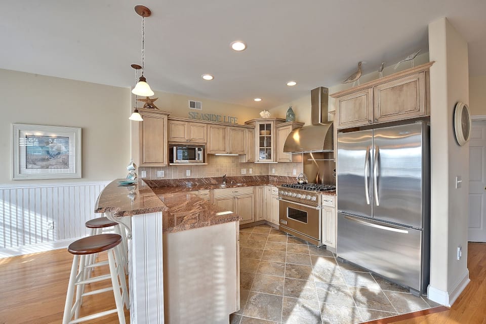 Floor 3: Breakfast bar facing kitchen, Viking double wide refrigerator 