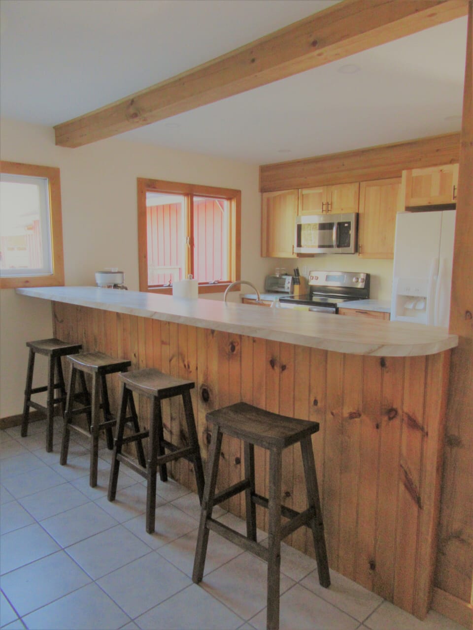 Newly renovated kitchen fully stocked with cutlery and cooking items.