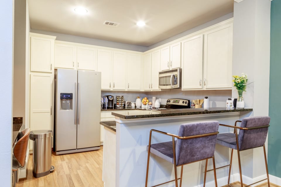 Beautiful kitchen space to cook and host guests. Fully stocked.
