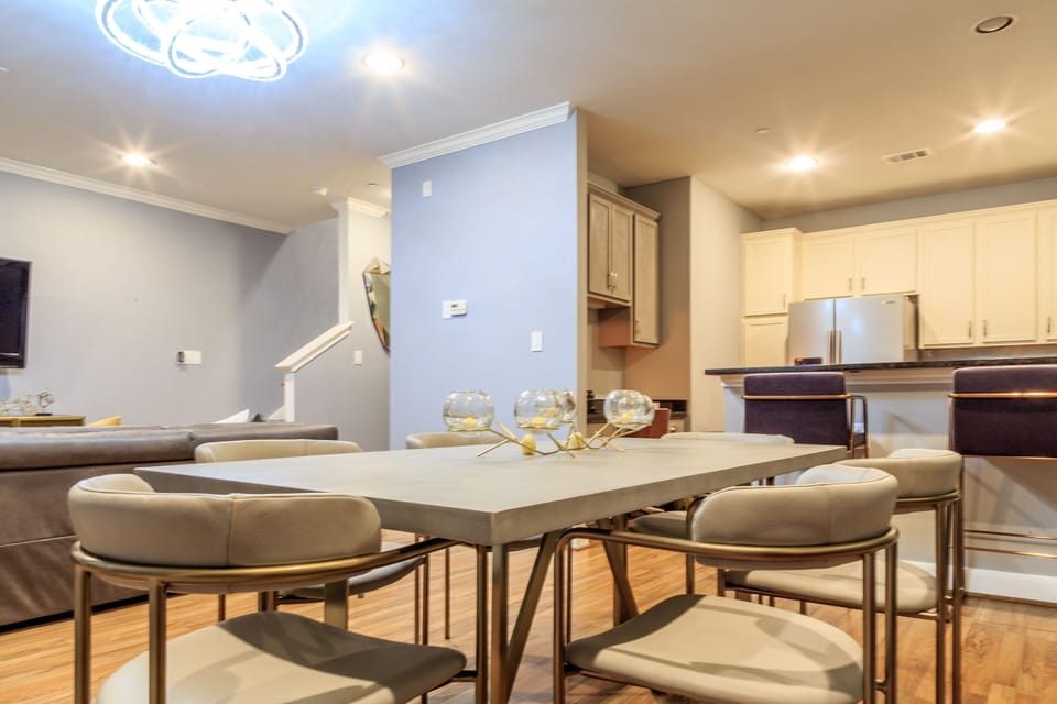 Modern concrete dining table able to accommodate 6 on table plus 2 on counter.