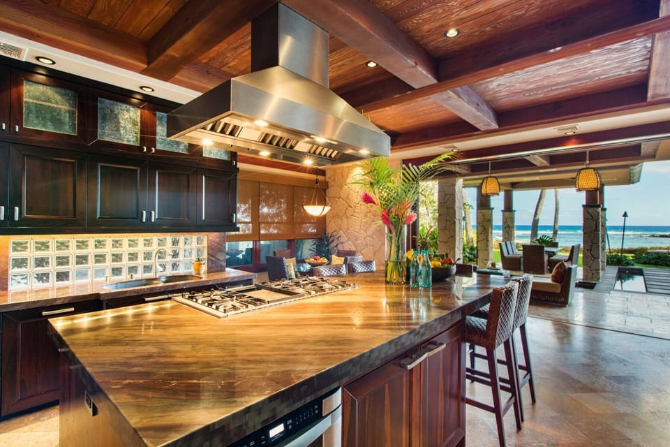 Designed for entertaining, the chef's kitchen features premium appliances, rich wood finishes, and generous space for cooking, gathering, and conversation.