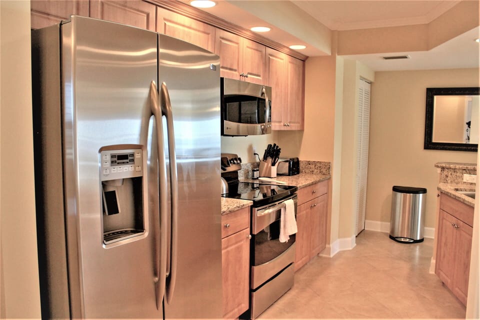 Stainless steel appliances and plenty of granite countertop space.