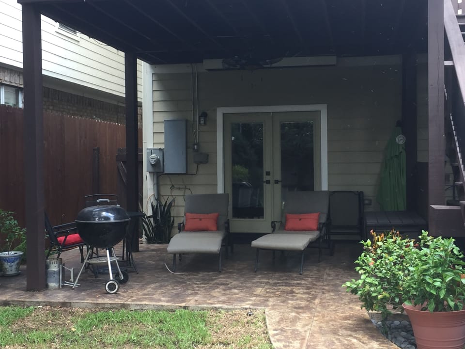 Grill, small table and chairs plus lounge chairs on 1st floor patio