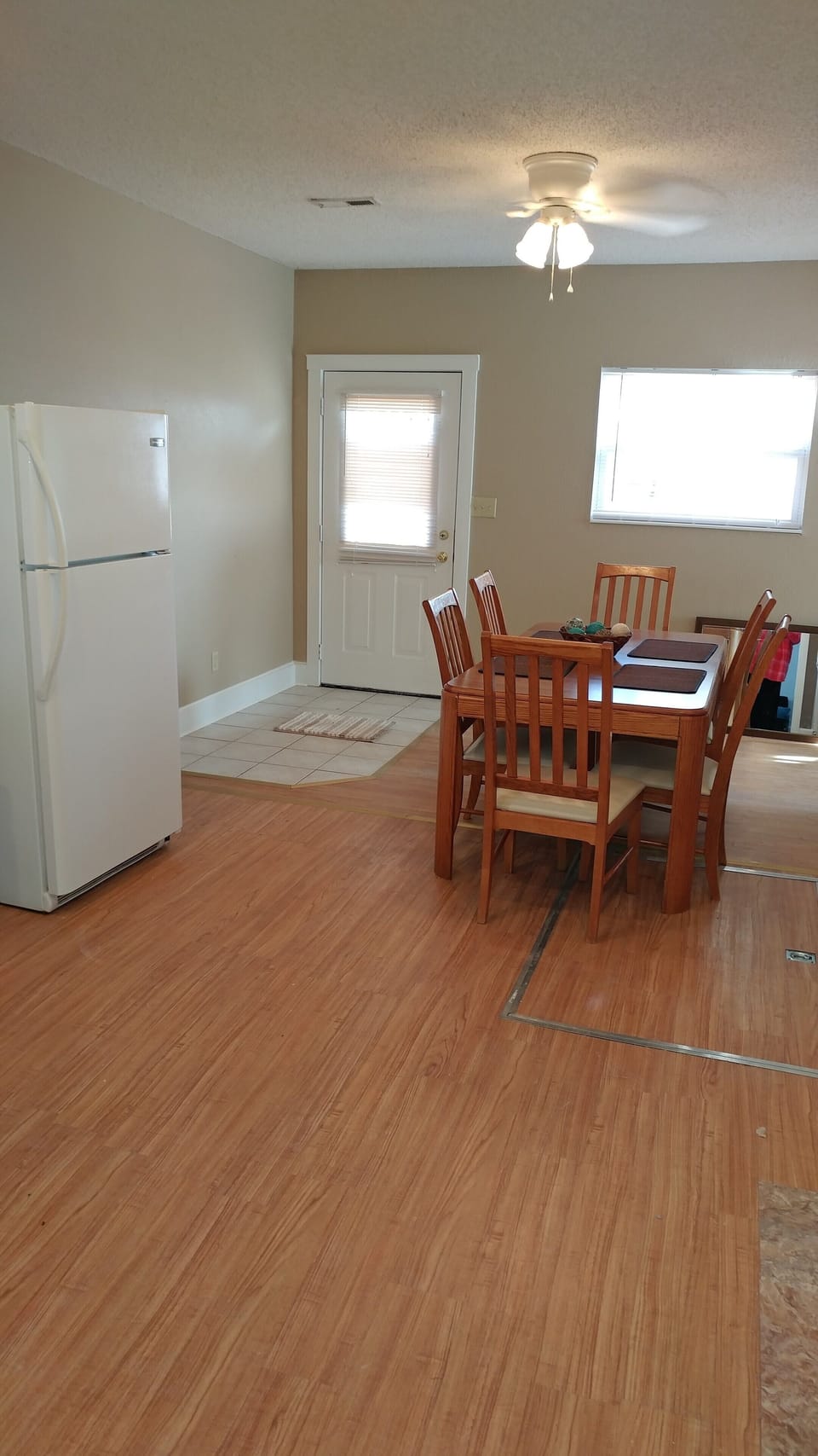 Kitchen from dining room door thru to back door - bathroom off to right