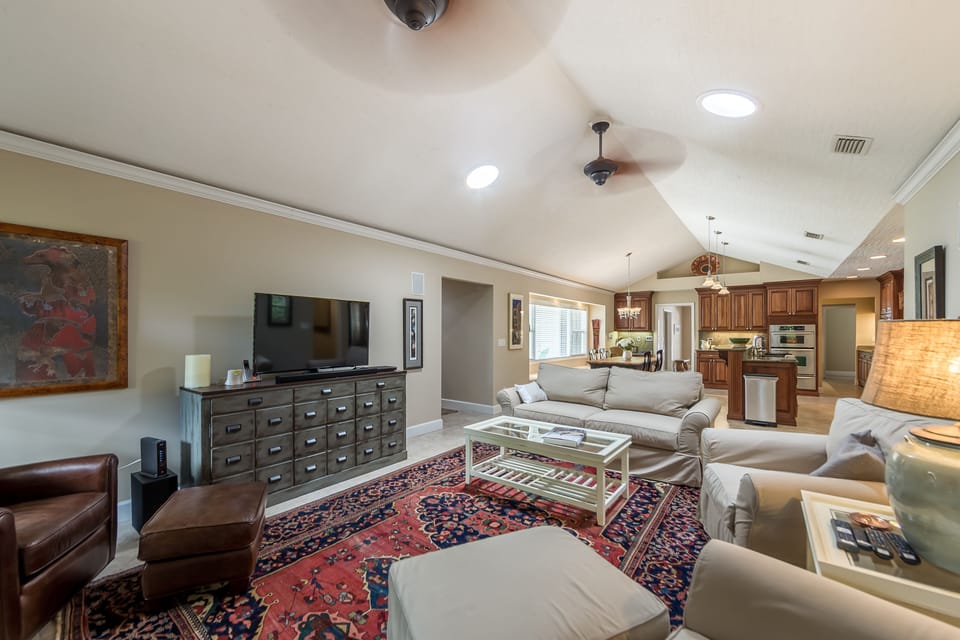 Look at this space for your family...rustic furnishings, kitchen, dining, TV.