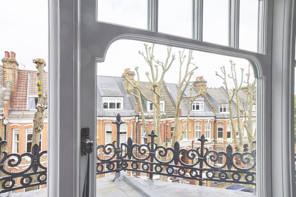Beautiful bay windows with period details and child safety locks. 