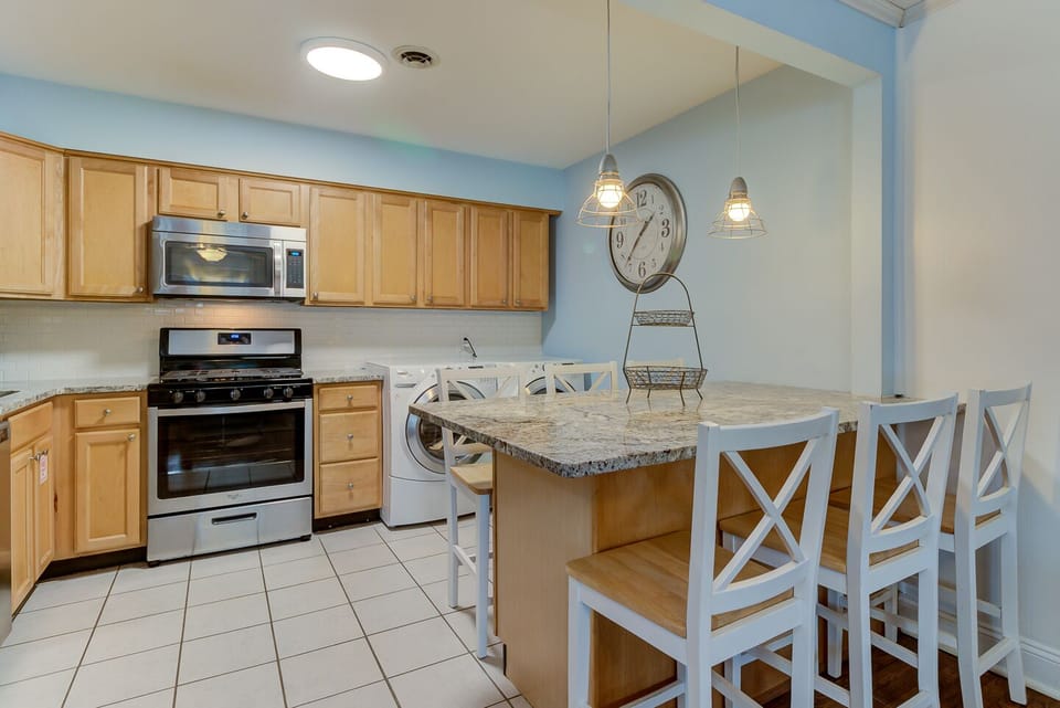 Full size washer and dryer conveniently located in the kitchen