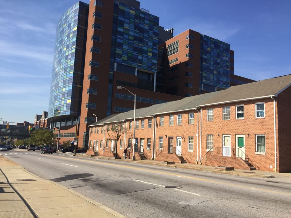 House is on the far right (with the green door) - half a block from hospital