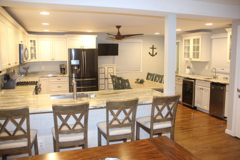 Kitchen and Dining area,  table seats 10,  4 at counter,  6 at bar table
