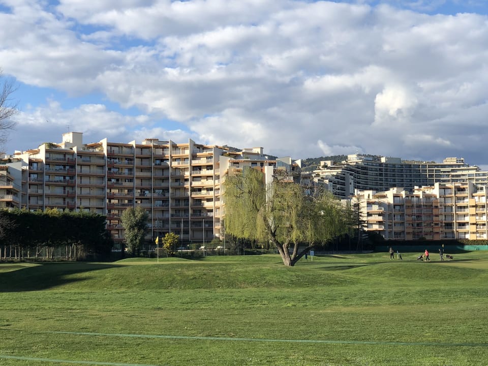 apartment building (right) as seen from the golf course